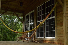 hammock on the porch and deck chairs.